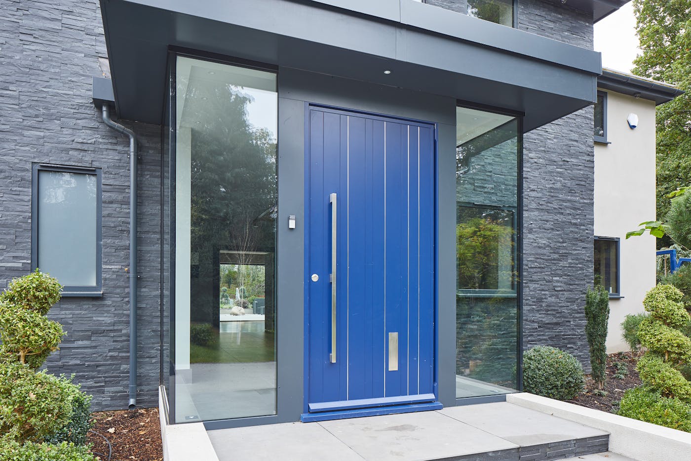 this glass box entrance certainly creates an attractive result