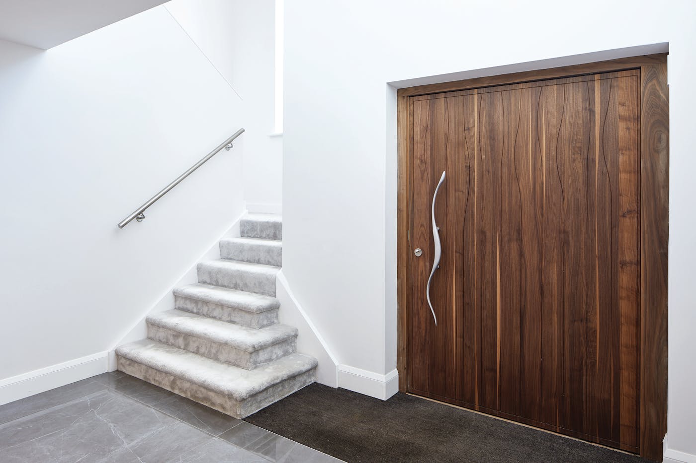 Choose a statement handle, this one follows the wave pattern on the door