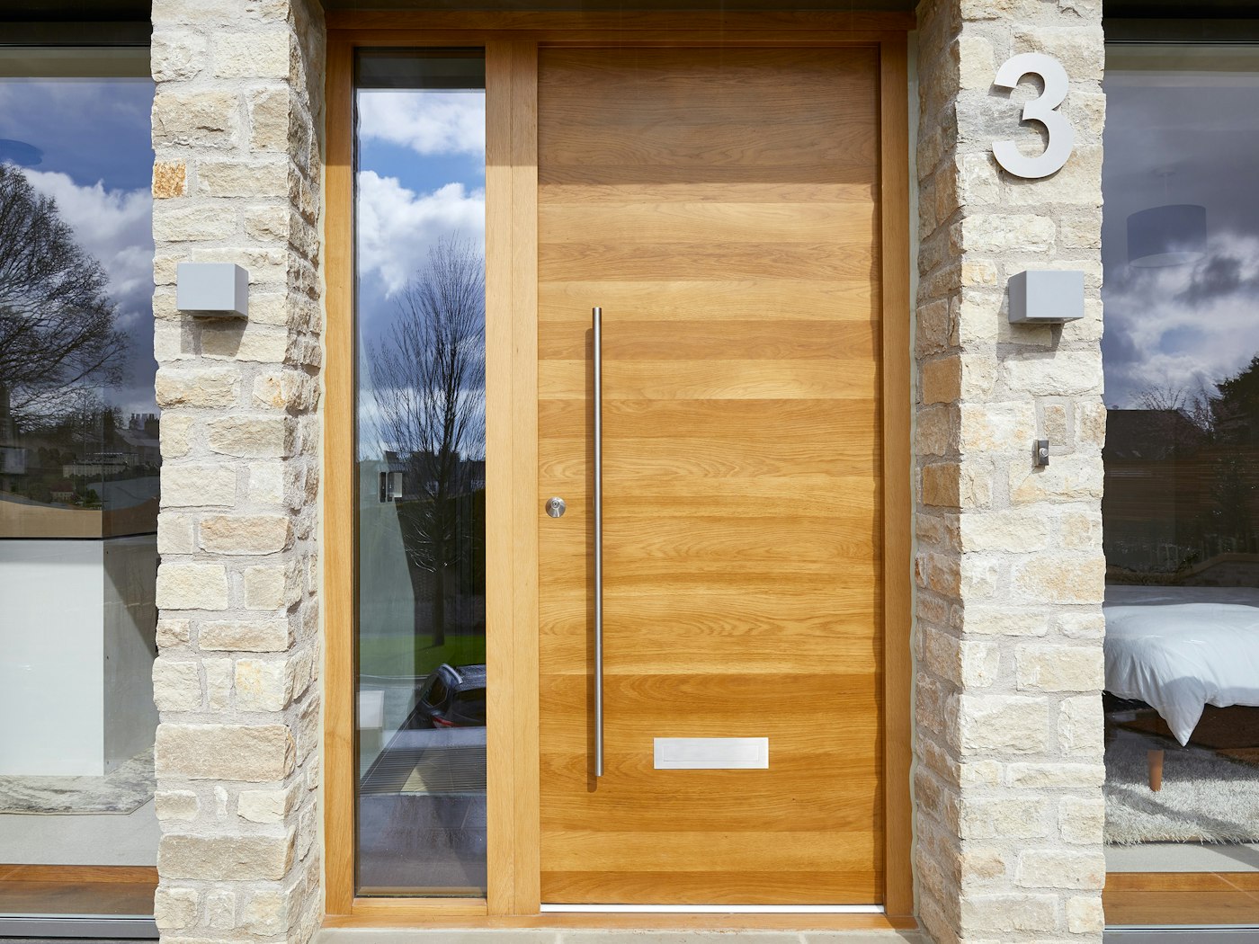 Using a large door number by a simple door creates interest