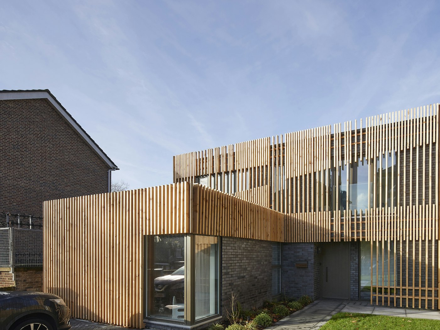 This contemporary build goes a step further with uniquely designed vertical cladding across the entire design