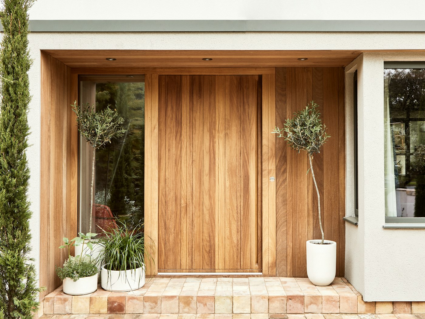 Natural hardwood is the perfect material for statement or understated doors