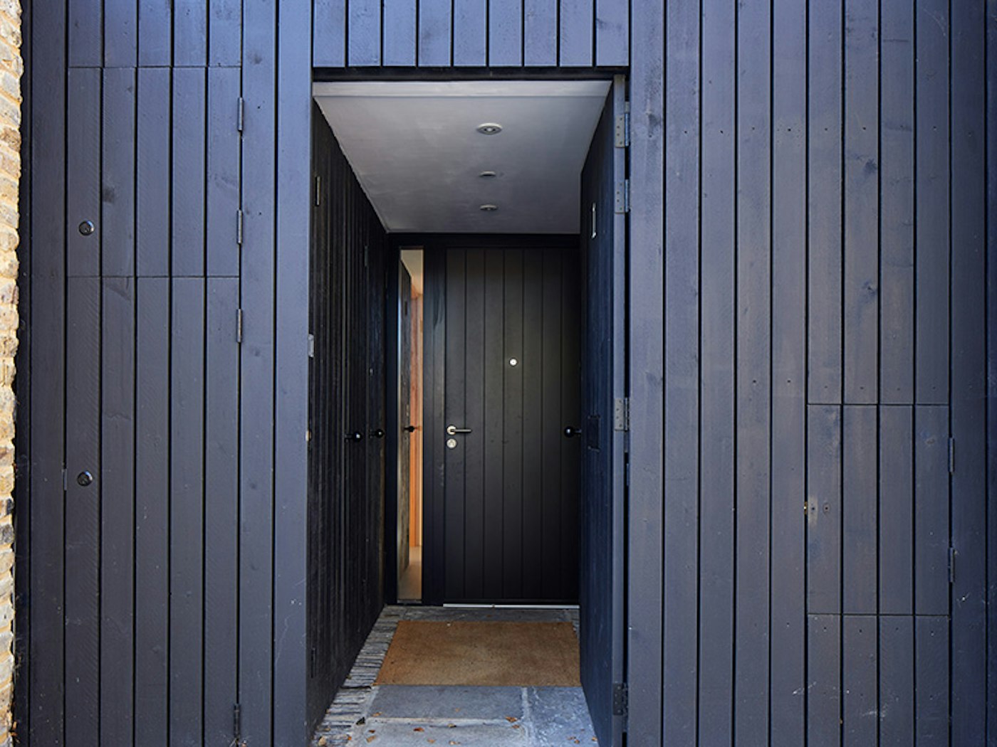 Black door with black cladding