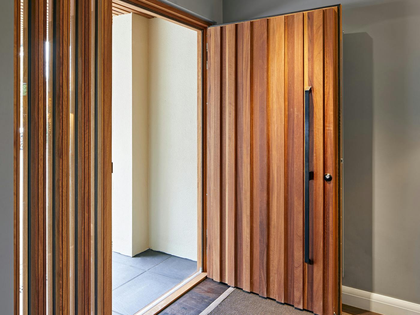 This design can add further interest when combined with a glass side panel, where the raised elements add continuation to the door design 