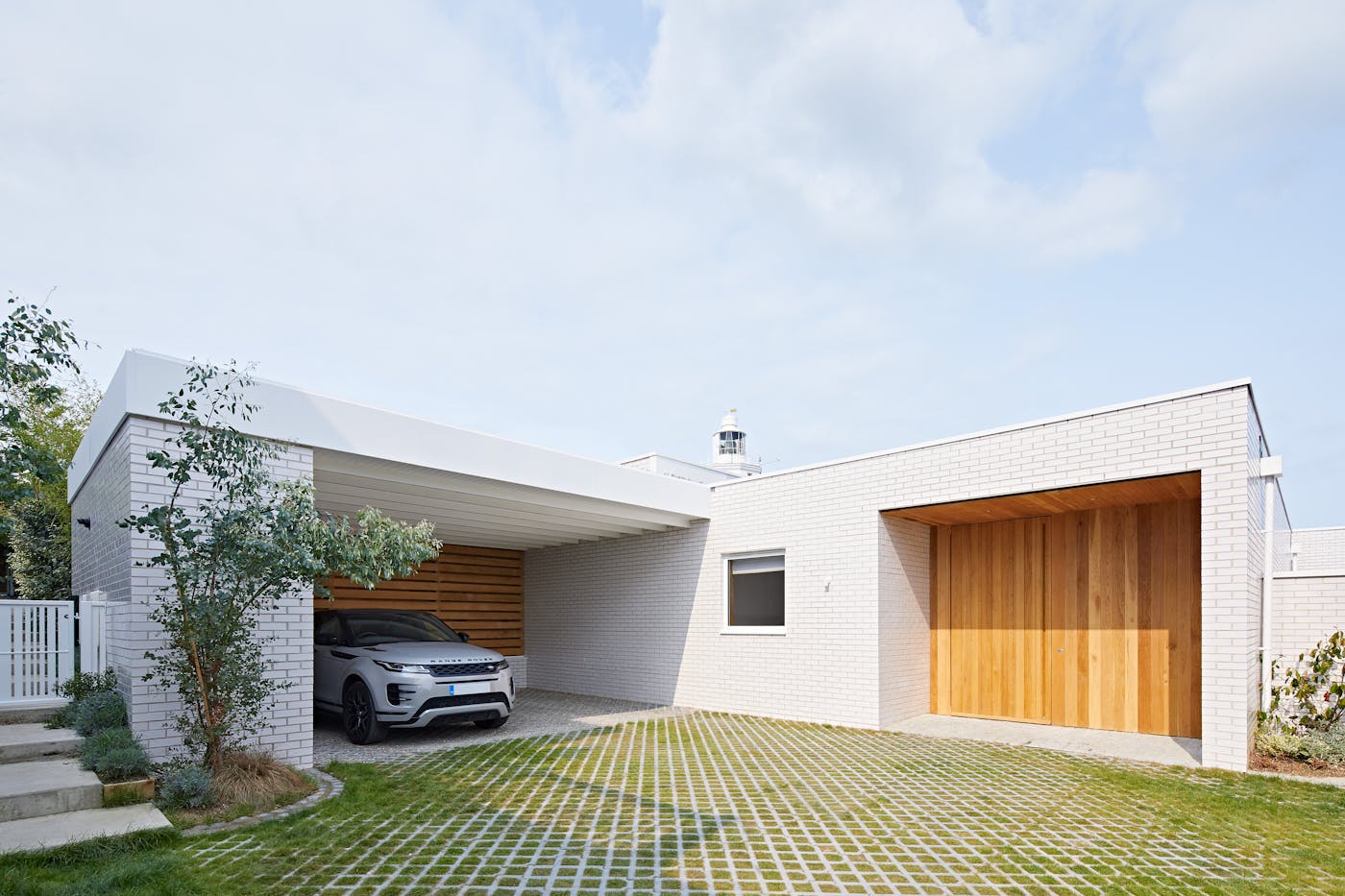 Less is more - minimalist details like concealed handles and simple design blend beautifully with cladding to create an understated entrance