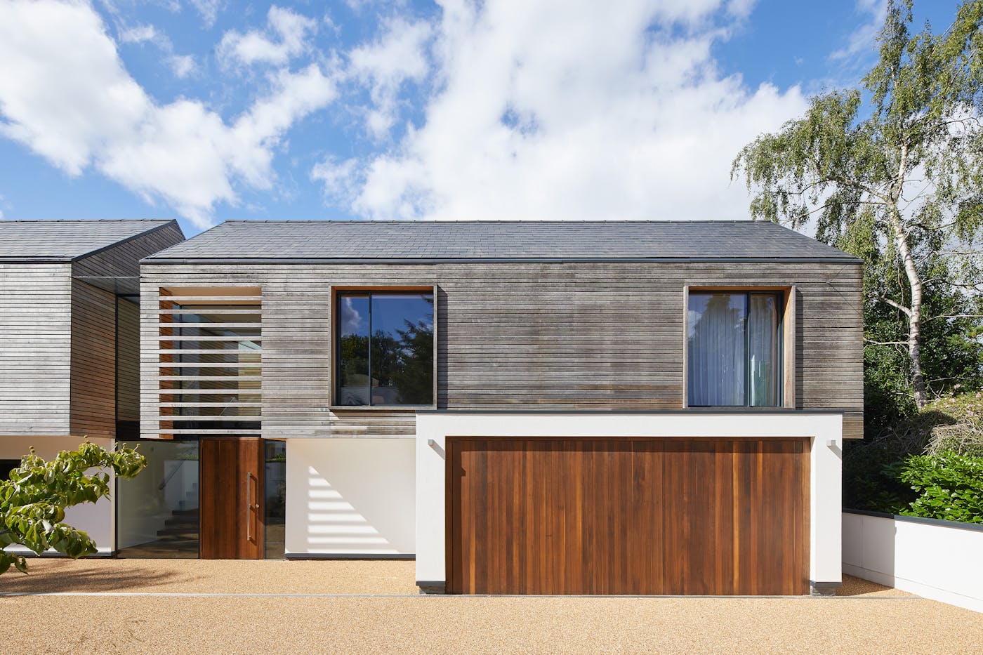 Outside sits an even more impressive up and over matching garage door!