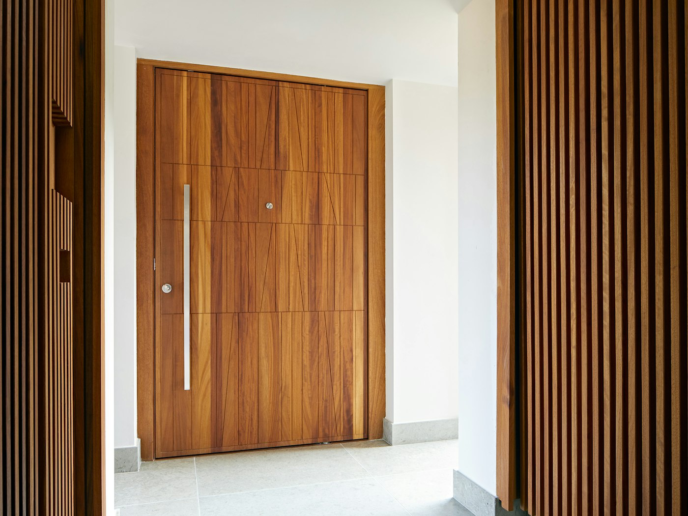The unique door design adds geometric shape to the oversized door
