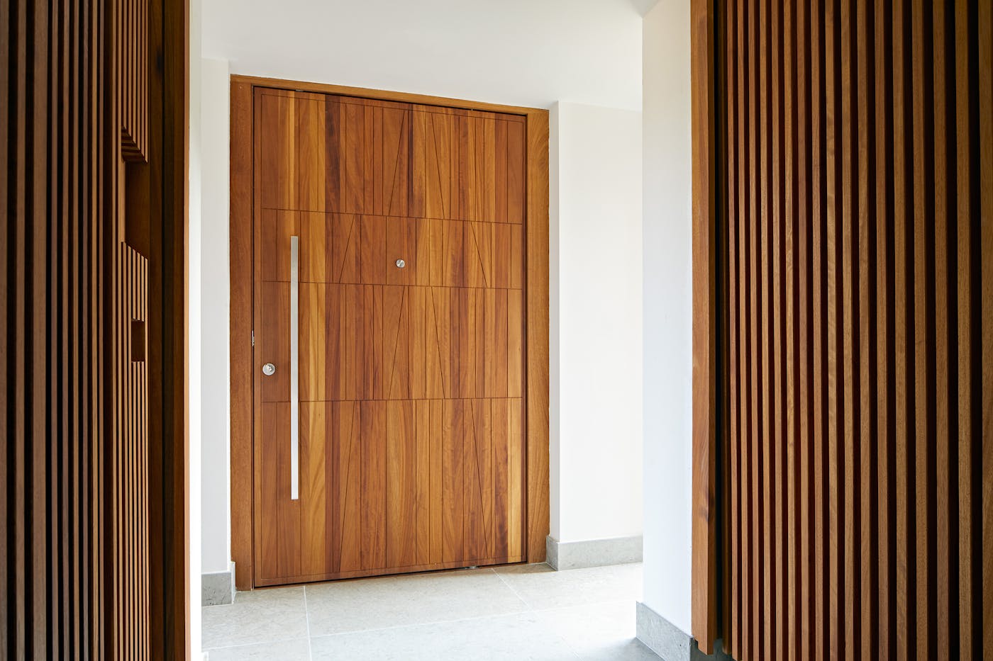 The unique door design adds geometric shape to the oversized door