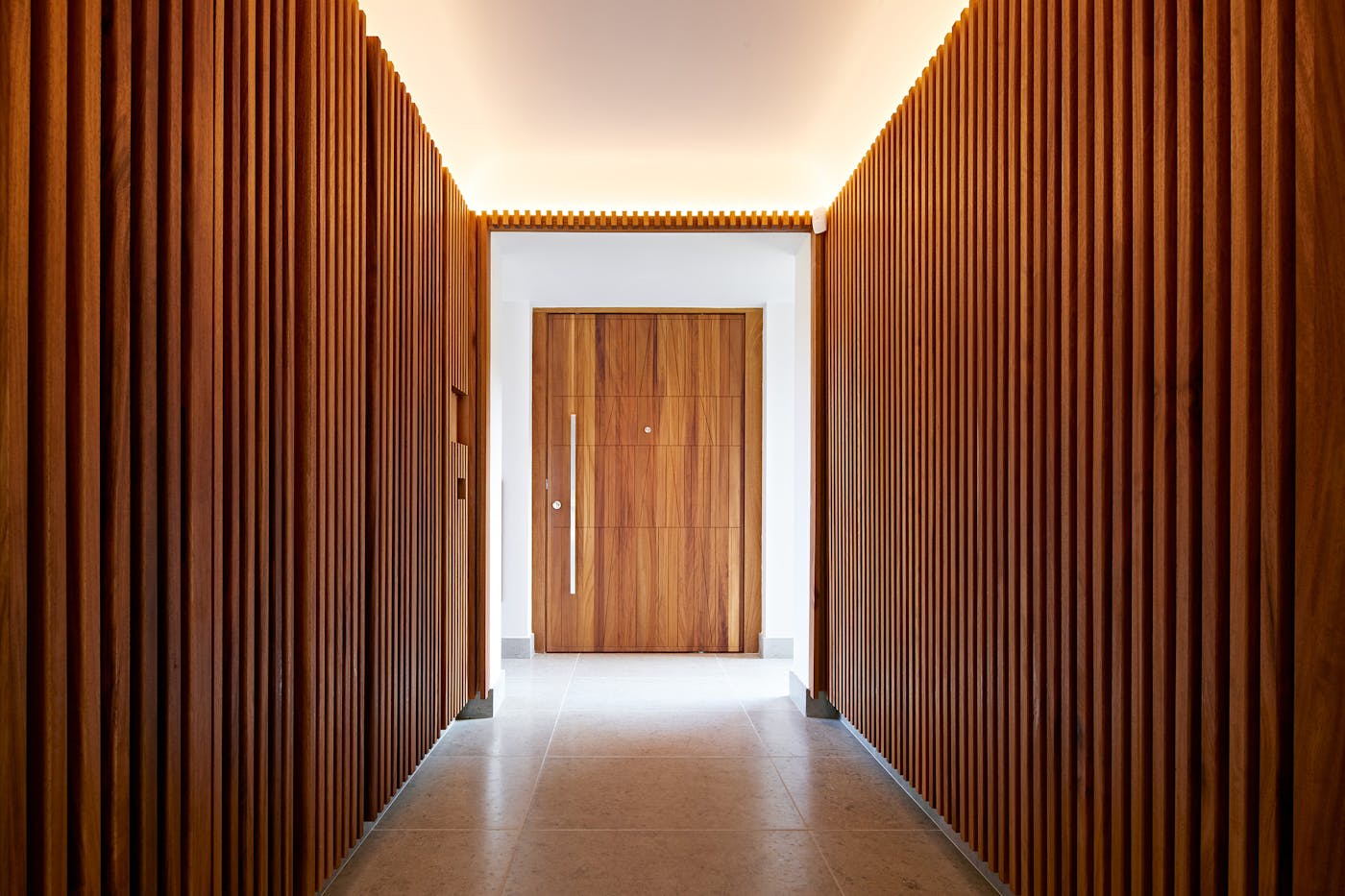 Spectacular internal cladding matches the equally spectacular door in this striking hallway