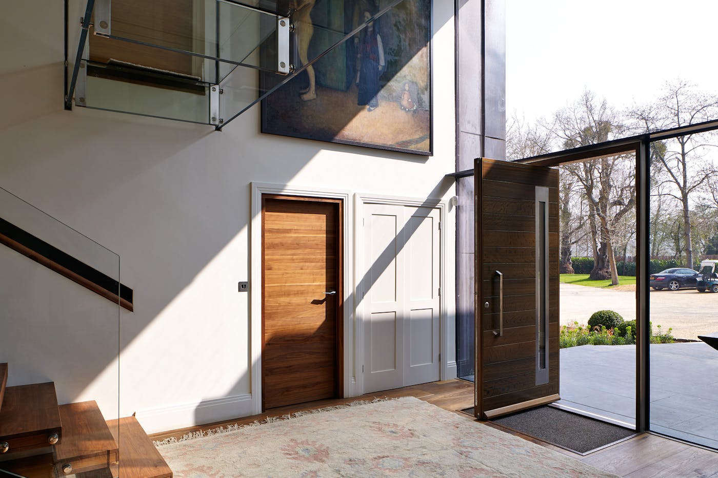 Glass walling floods this hallway with light