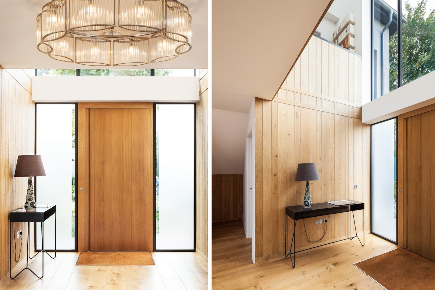 A spectacular chandelier lights the way as a contrasting console table sets up against light oak walls