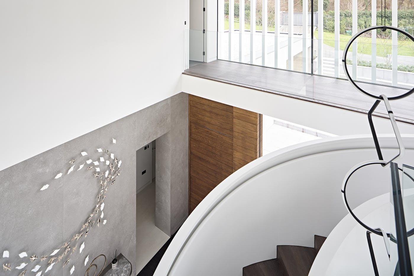 Hidden from immediate view, the wenge-stained stairs offer extra depth as you ascend the stairs