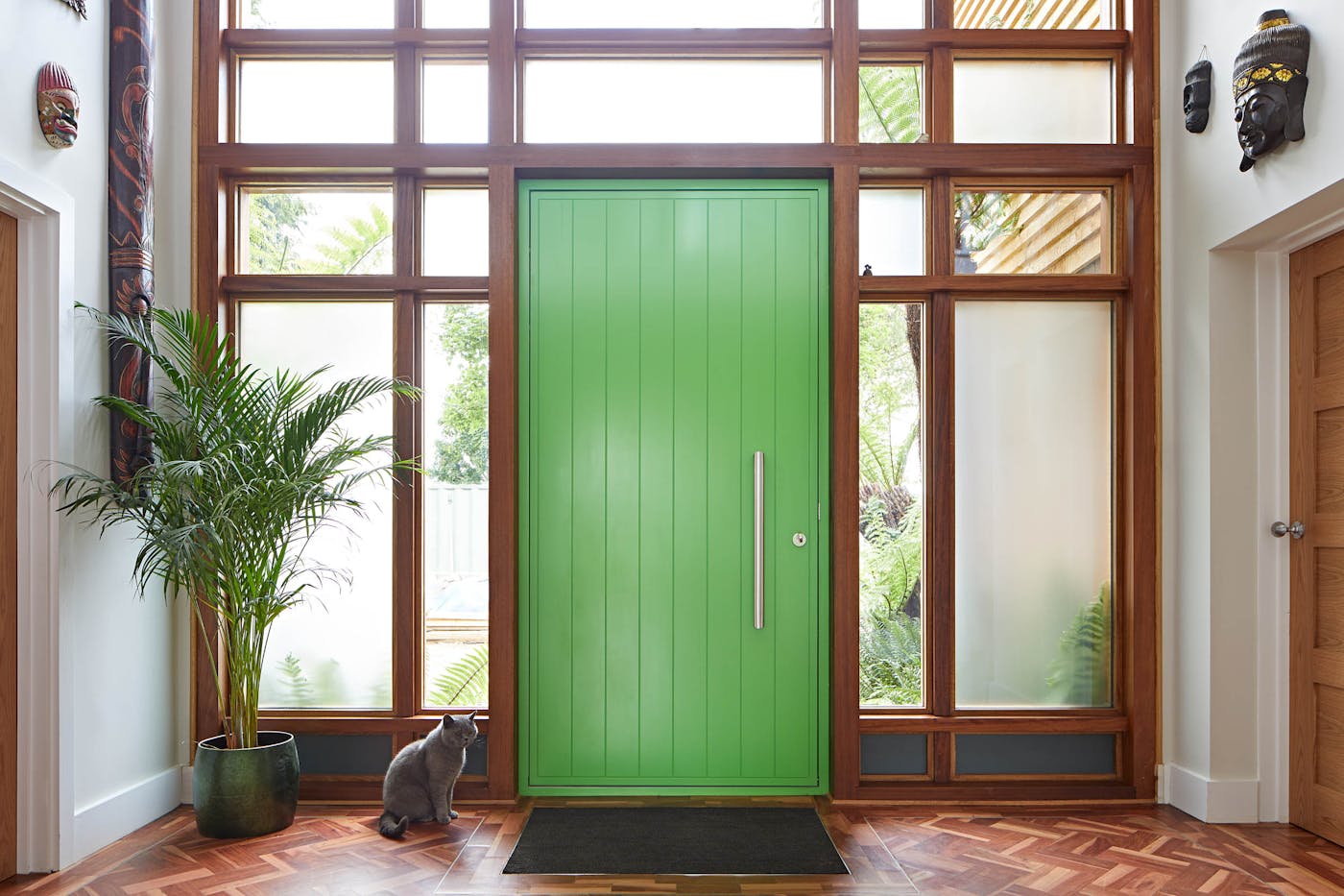 The wood and glass panels make the perfect frame for this colourful door