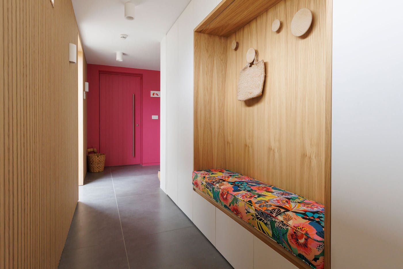 This bold dual door pops against the oak cladding and white walls