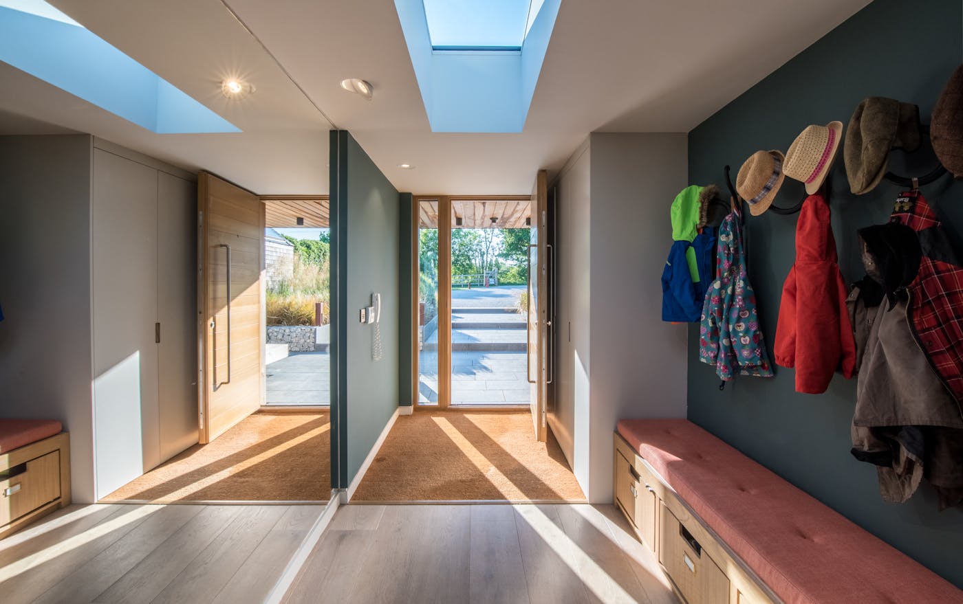 Practical and attractive, hooks and a storage bench keep this hall clutter-free