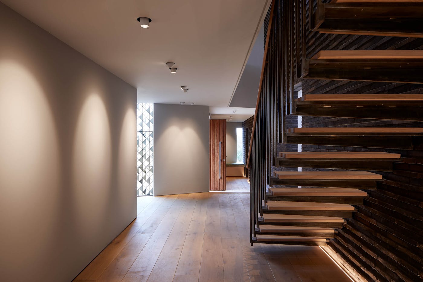 Texture and considered lighting create a memorable entrance