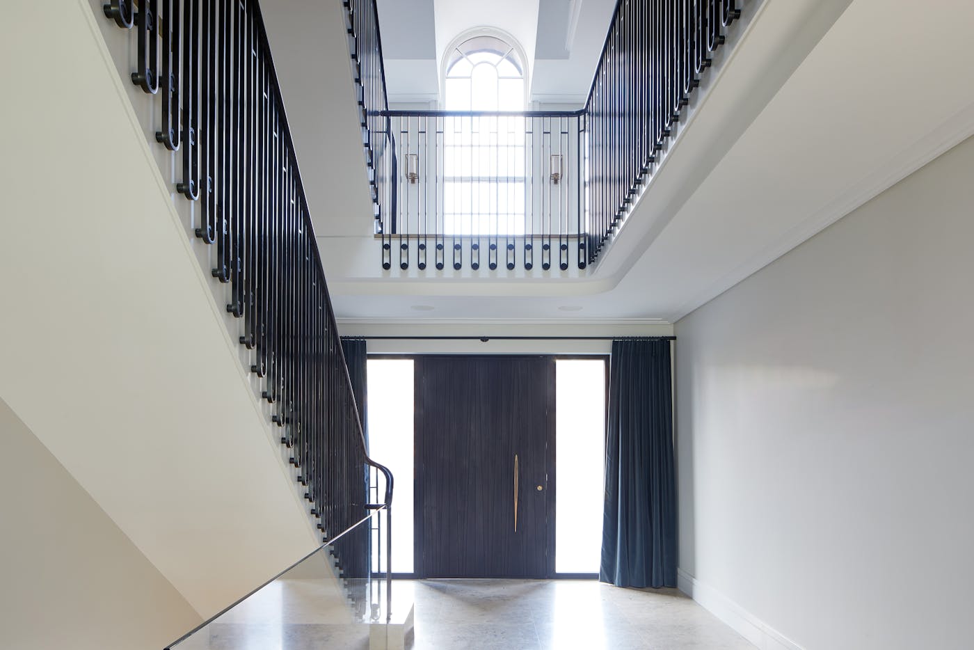 Symmetry, height, and light: this hallway creates a wonderful sense of drama