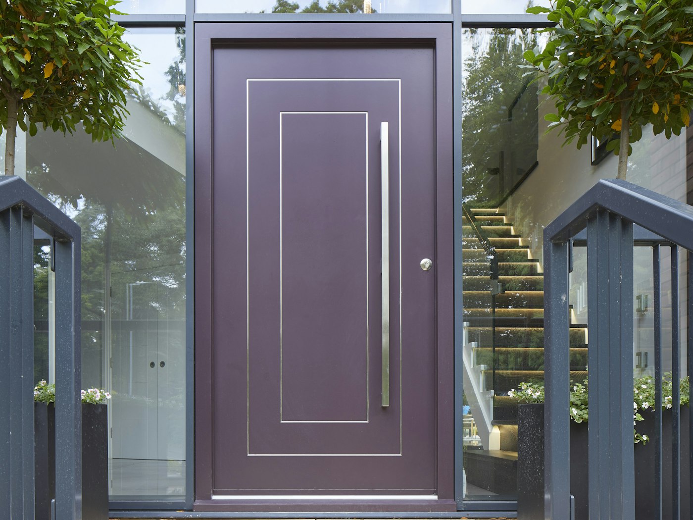 This Form purple front door features stainless steel strips in rectangular or square design and these elevate the contemporary styling