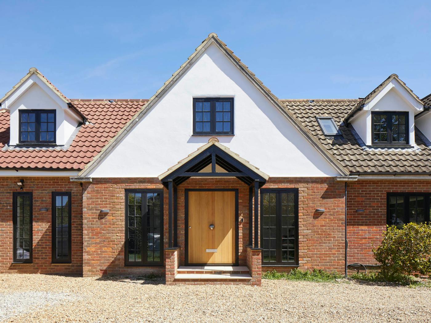 The contemporary door works perfectly with this home's traditional look