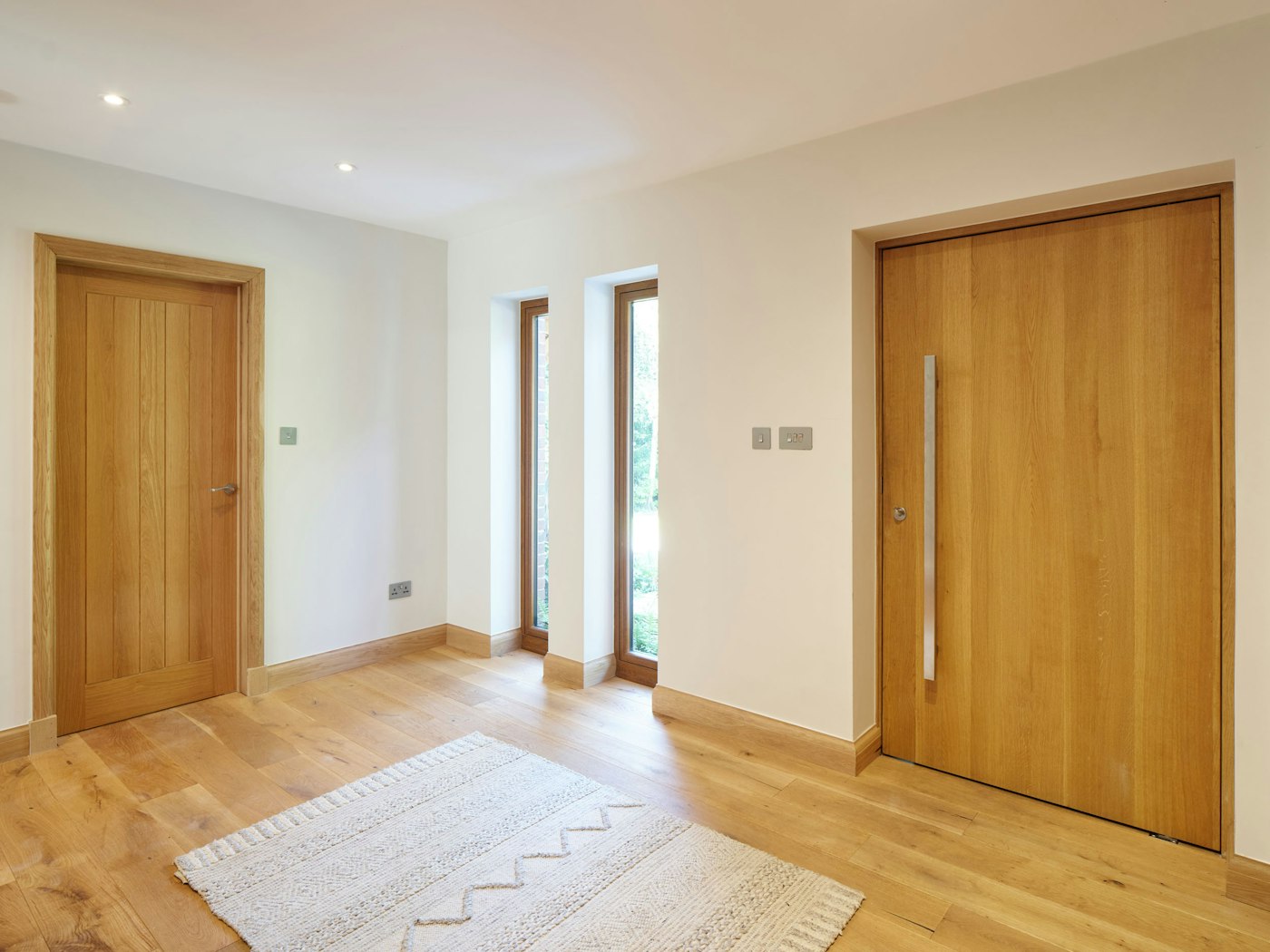 The inside of the door is a simple raw finish to complement the wooden floor and internal doors