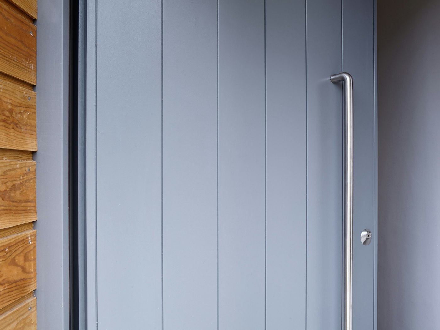 A large handle on an otherwise normal sized door will draw attention