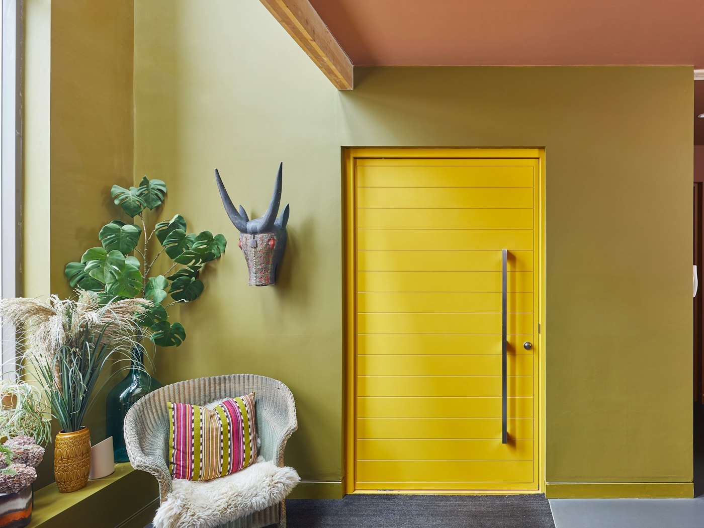 Yellow front door with silver stainless steel door handle
