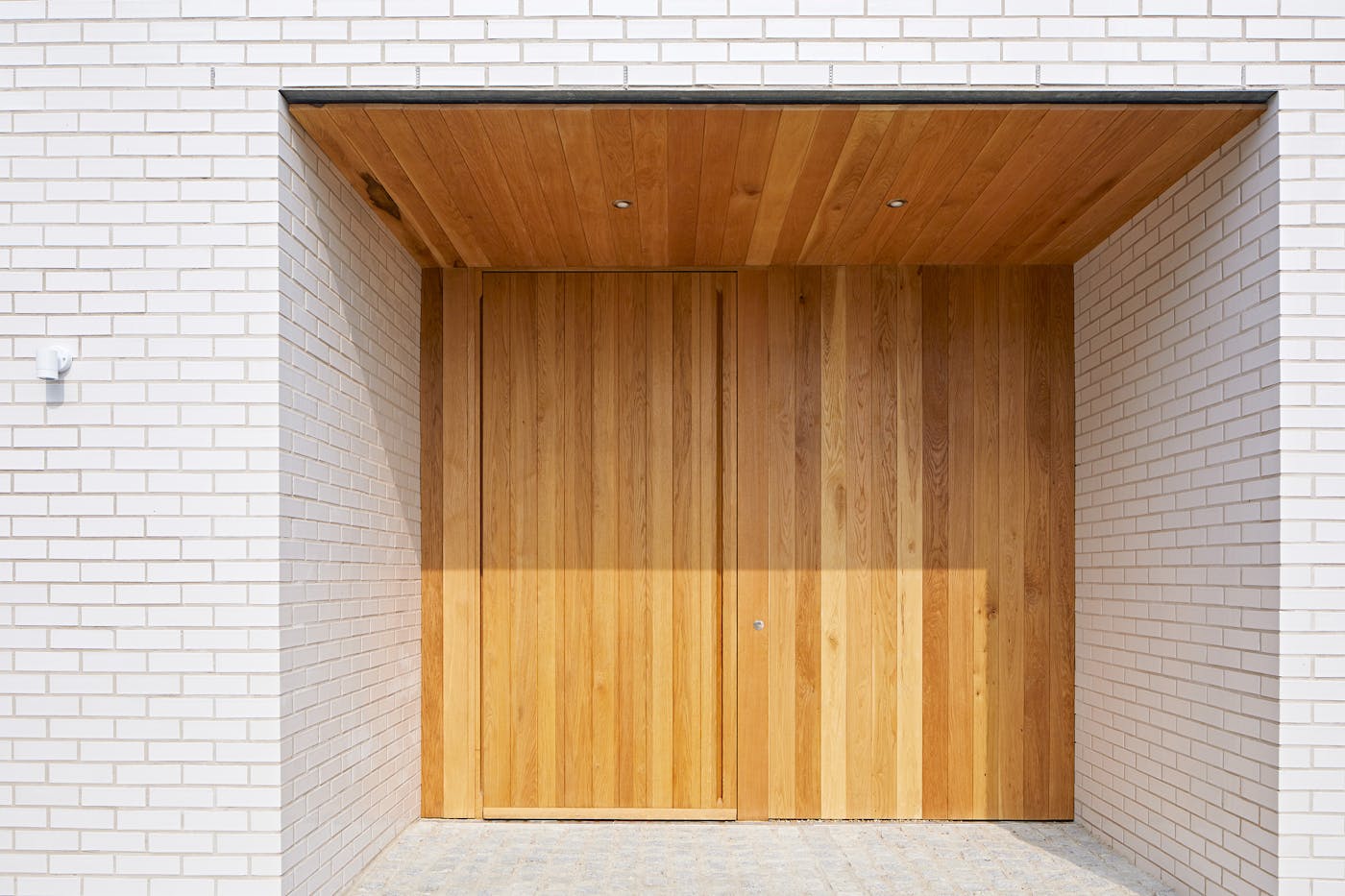 A sizeable canopy or porch is the best way to minimise wood door maintenance