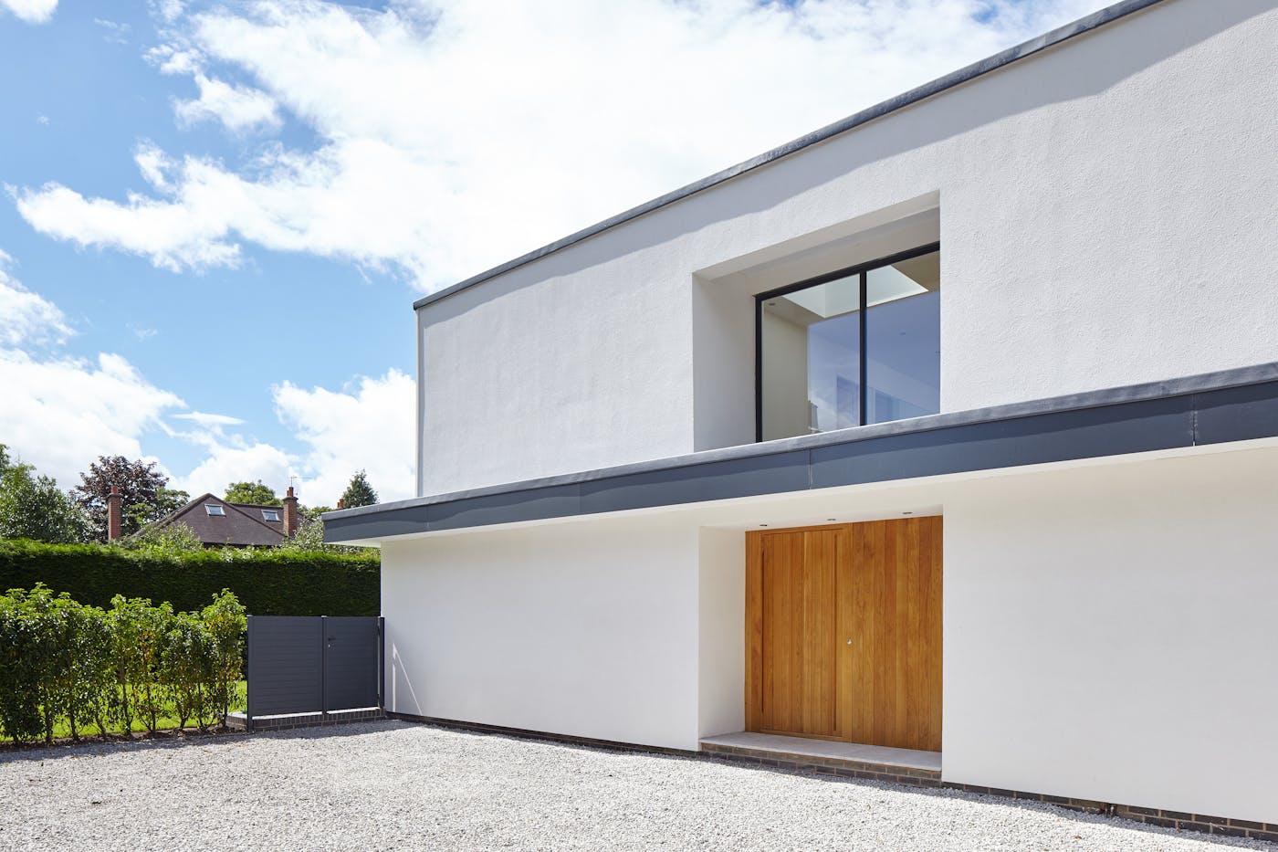 This flat overhang forms a part of the building design and gives excellent coverage to the flush front door