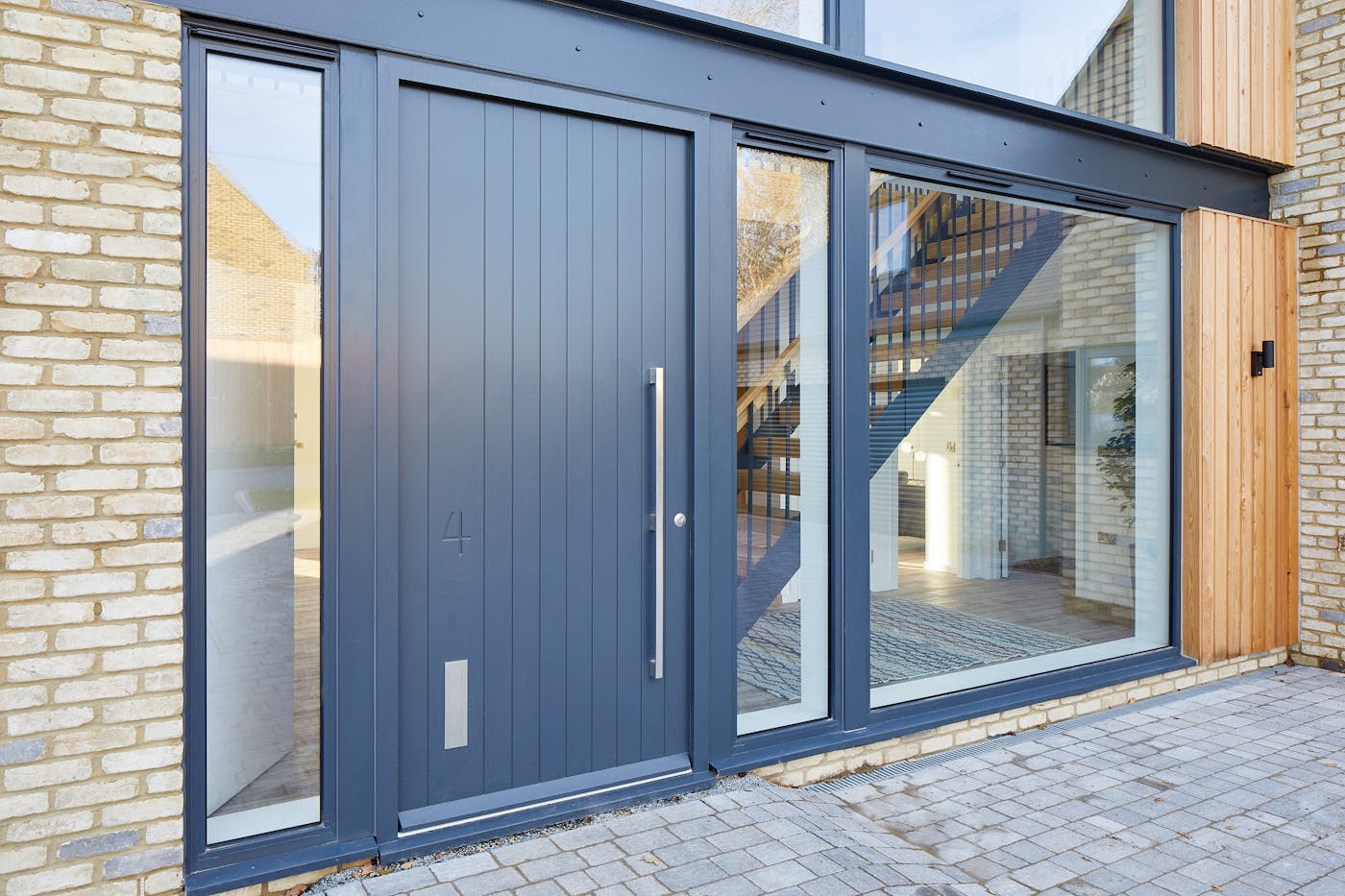 A hinged, painted door can also offer an easier life if a canopy or porch protection isn't an option