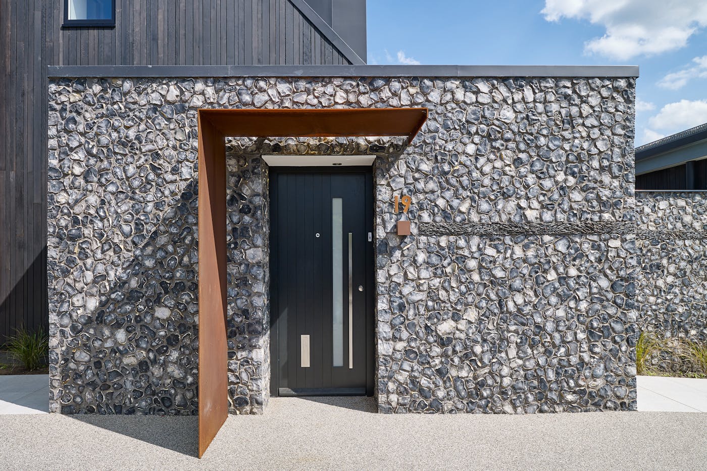 A contrast in material and colour sets this metal canopy apart as a unique design feature