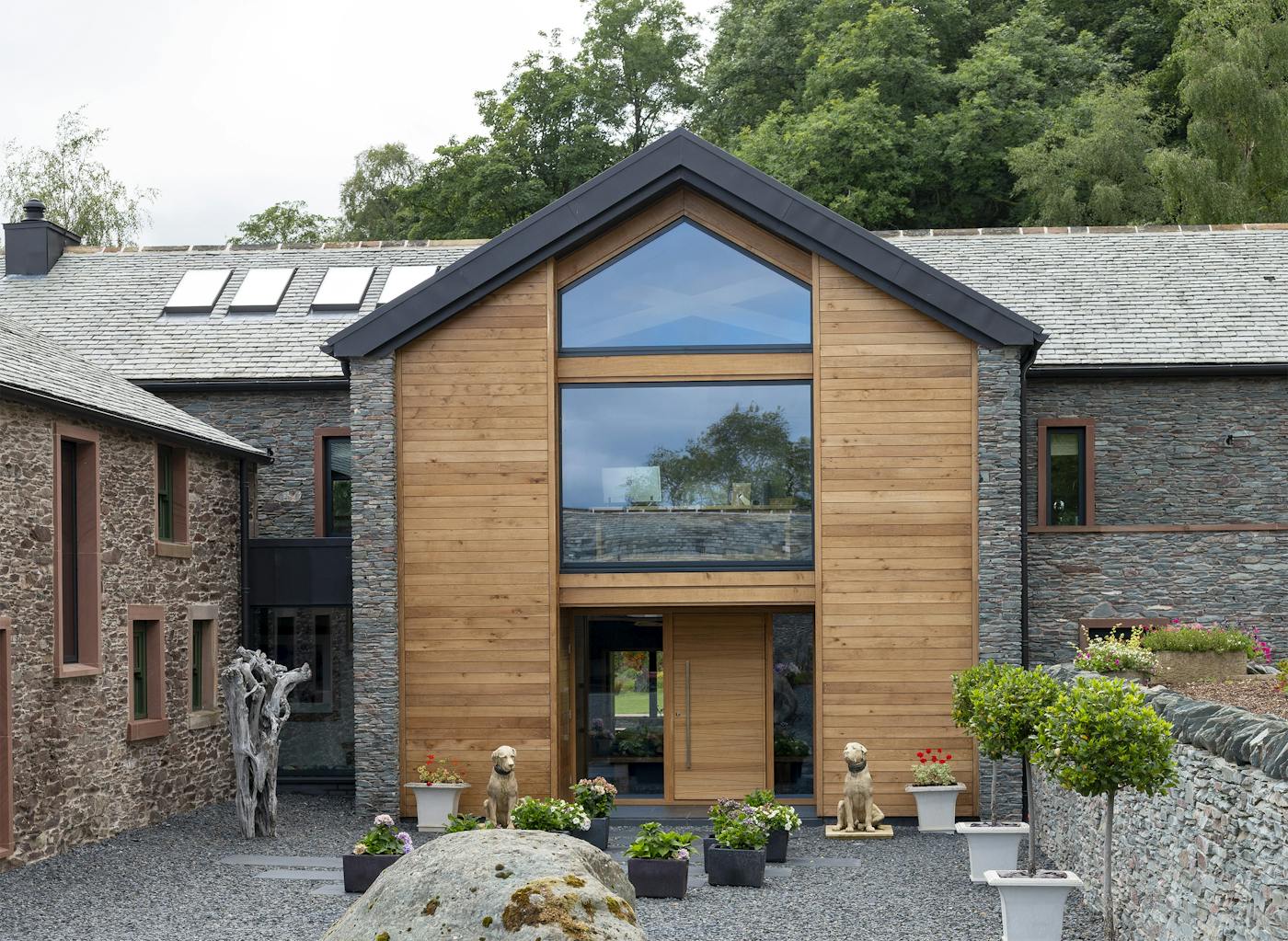 The front door and cladding are both European Oak - but the different design of the front door helps to create an individual identity