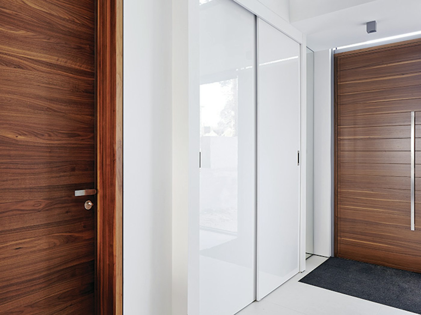 sliding cupboard doors match the wall whilst the front and internal doors are  similar