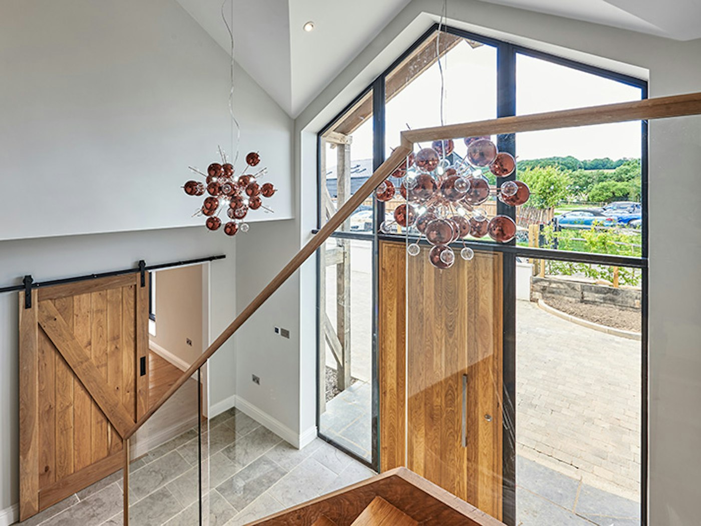 the front door and sliding barn door work really well in this barn conversion