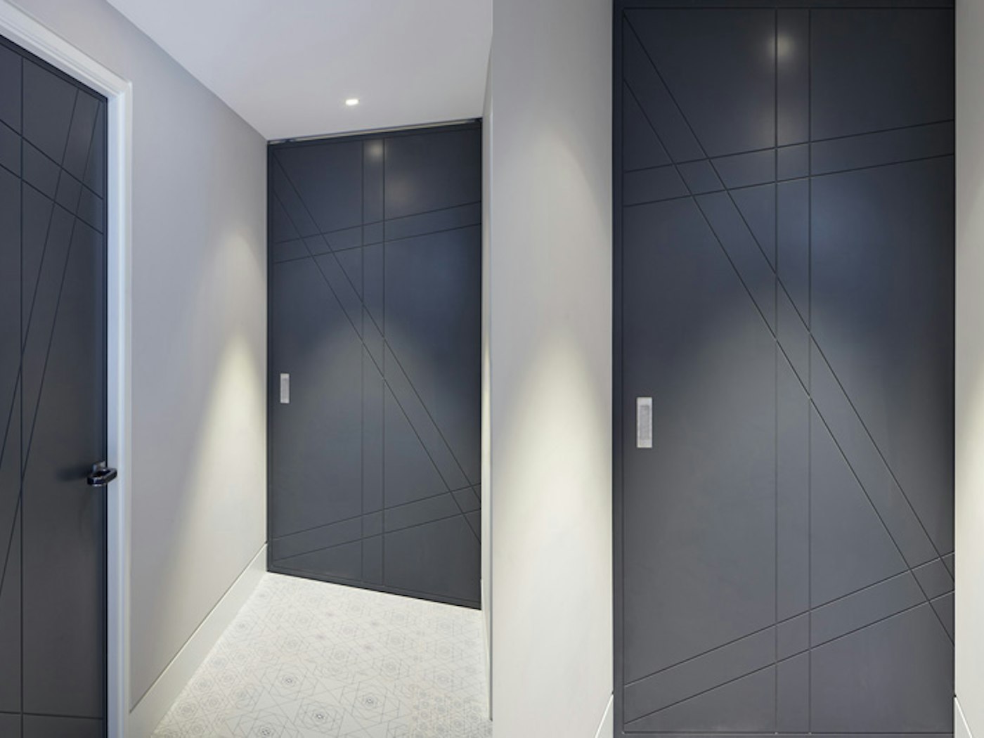 in this hallway the same design and colour have been used as well as a space saving pocket door