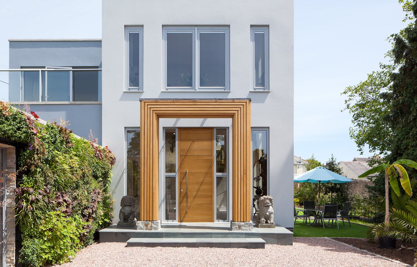 Making a door look bigger than it actually is helps create a grand entrance