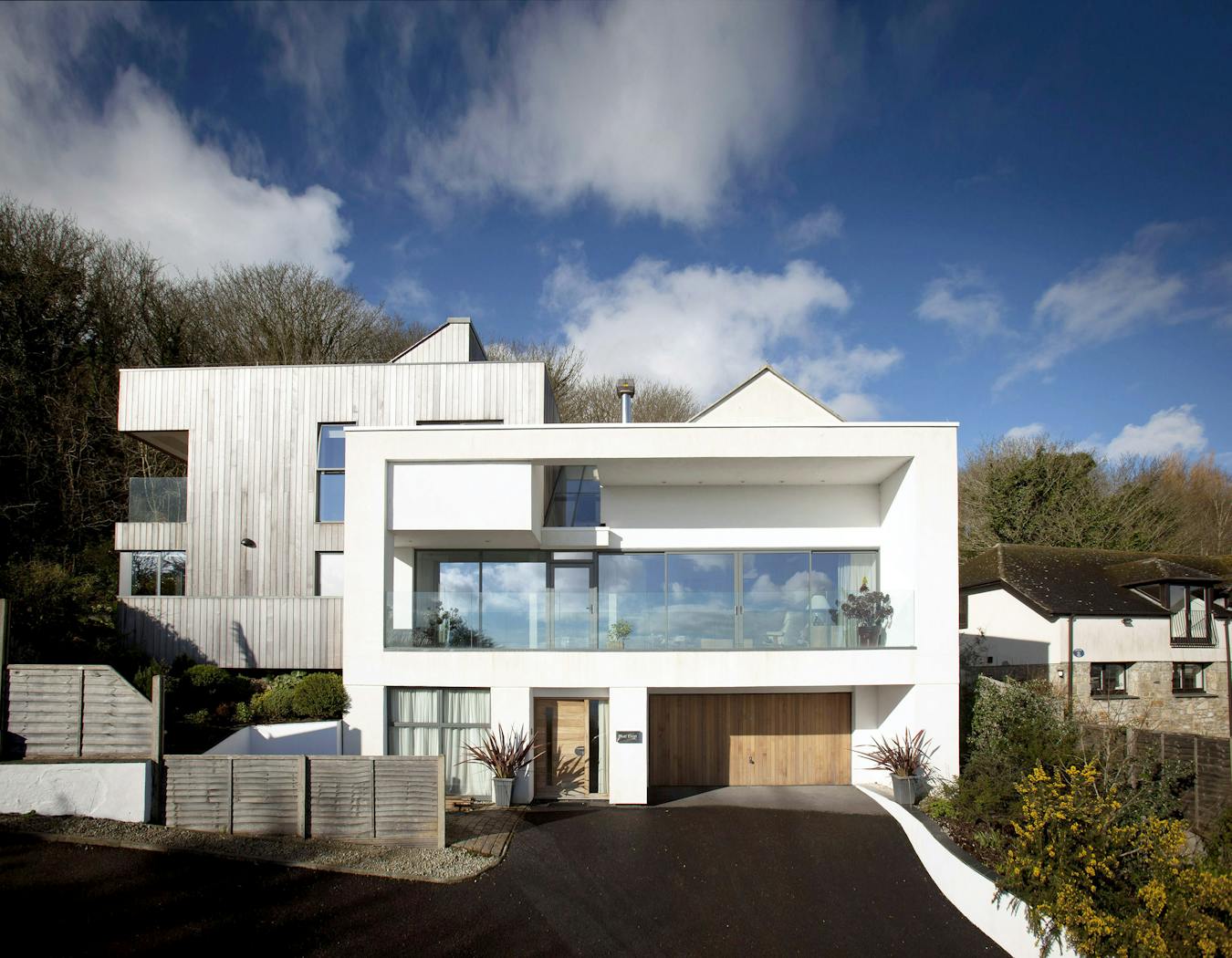 Columns either side of the door prevent the garage from being visually dwarfed by the garage