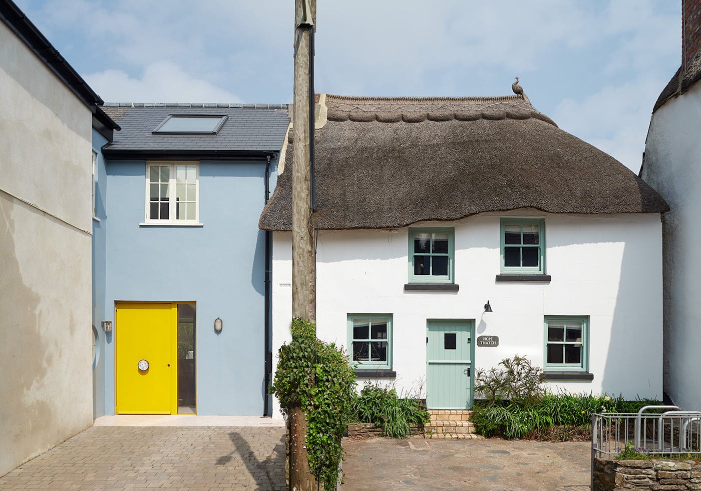 You can't miss the stunning yellow of the bespoke Smurf House door