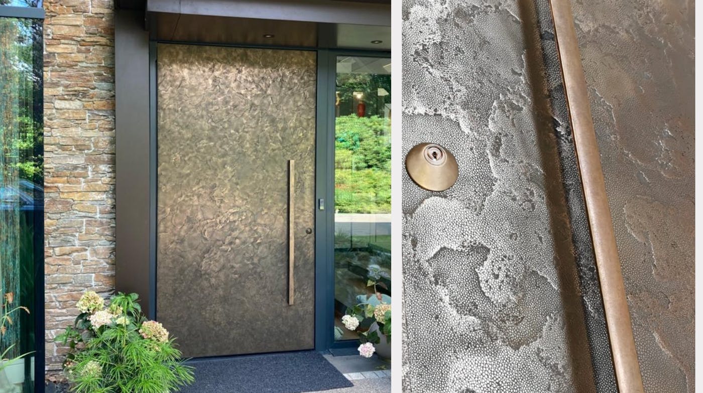 Bronze door in a texture 101 finish with a bronze handle