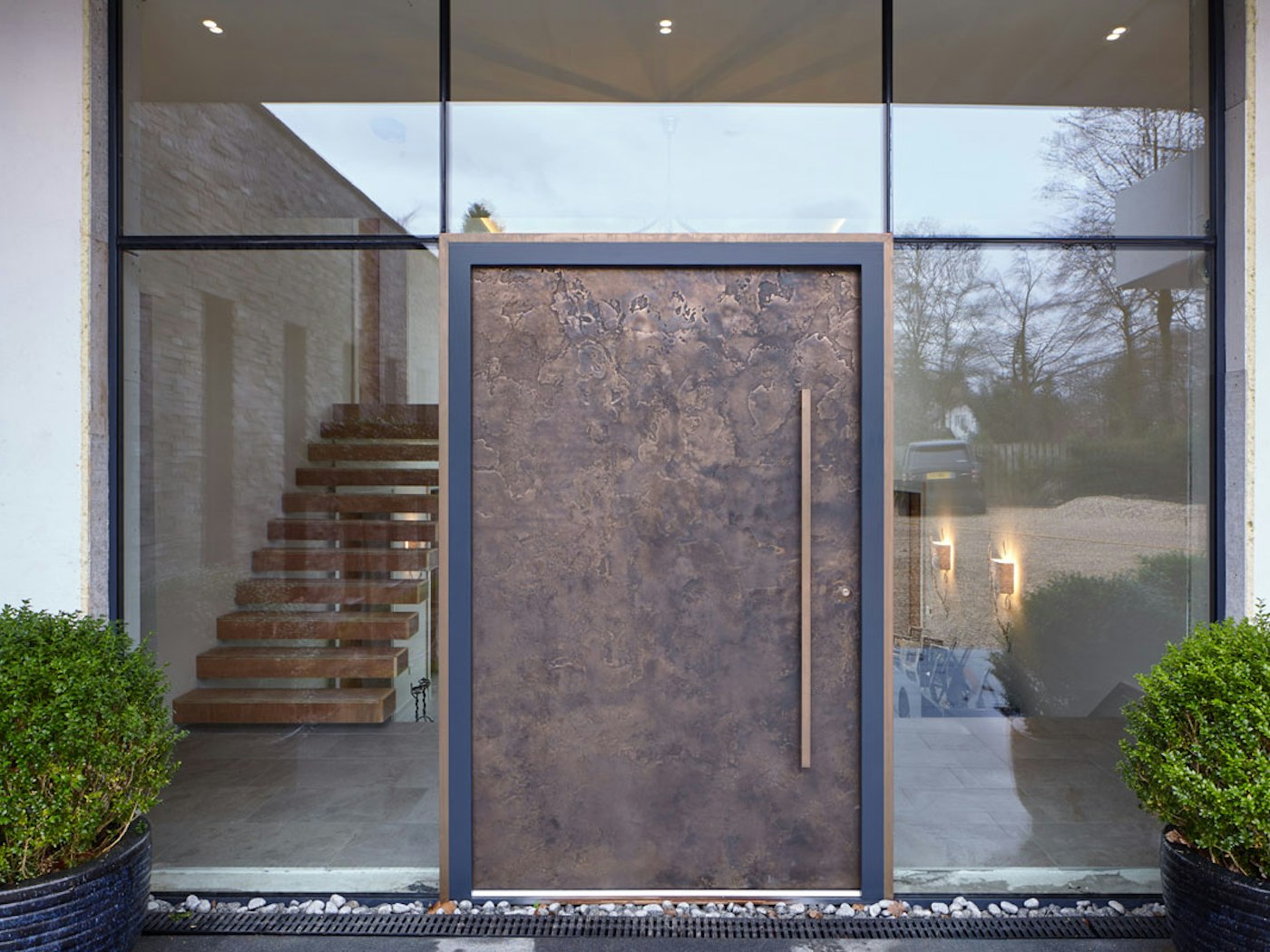 Bronze ref. 101: Modern opulence is the statement of the day with our signature, textured bronze door finish