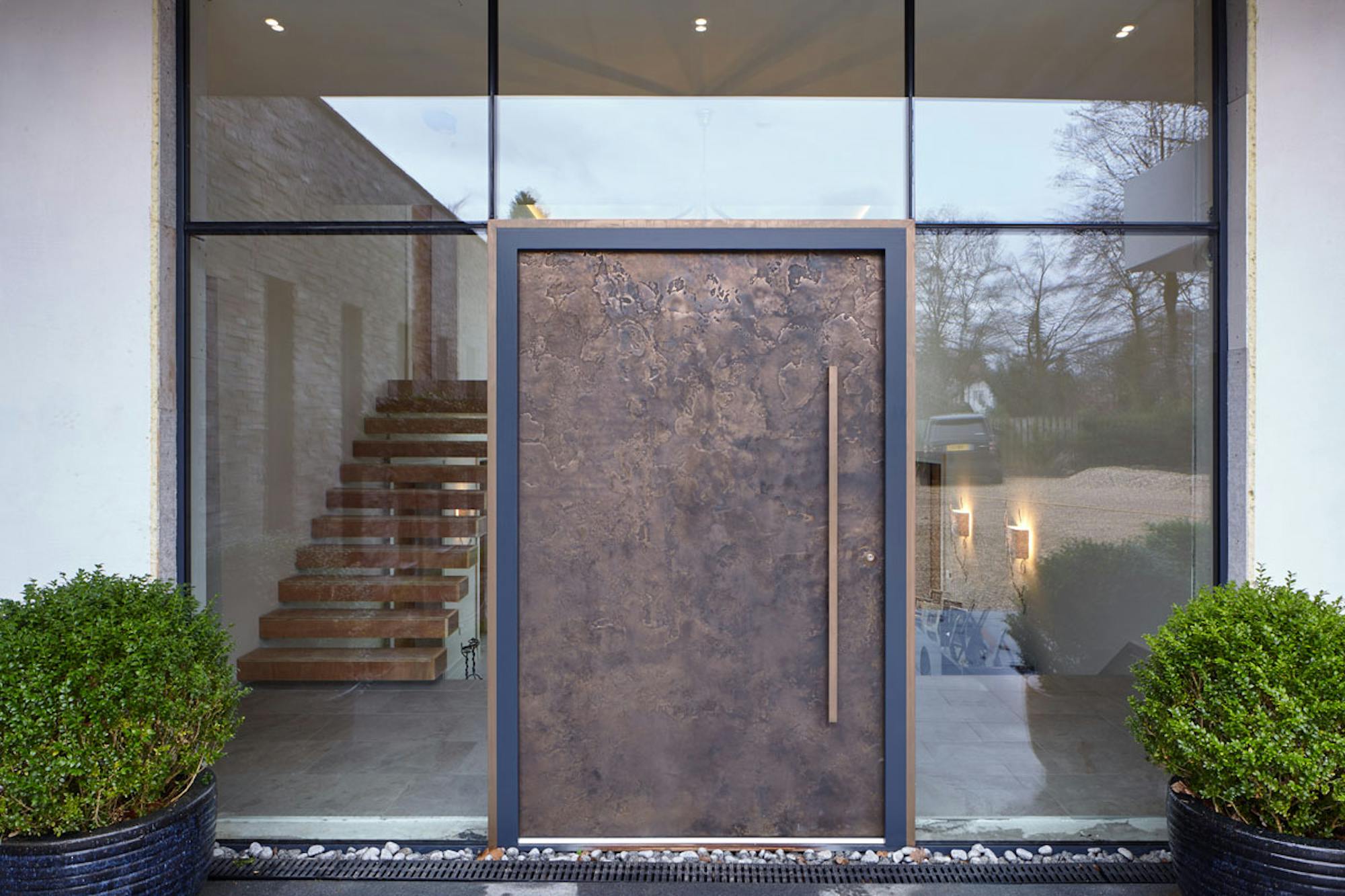 Bronze ref. 101: Modern opulence is the statement of the day with our signature, textured bronze door finish