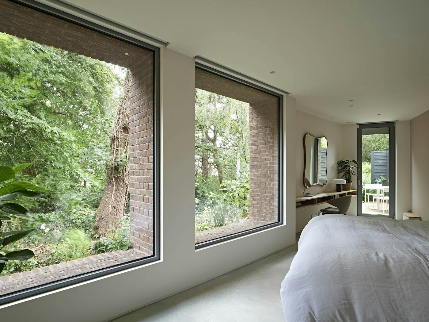 The awkward angles of the first floor were used to the maximum with plenty of light opening up the space (bedroom by Case Furniture)