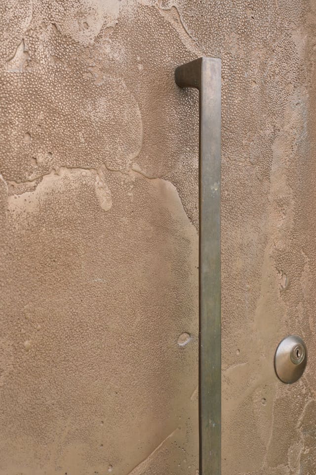 Portrait Cuttle Brook Barn close up of bronze finish and handle