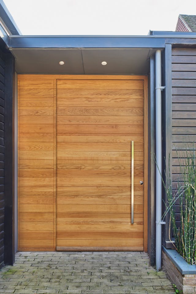 Portrait close up door closed and cladding Fir Tree House
