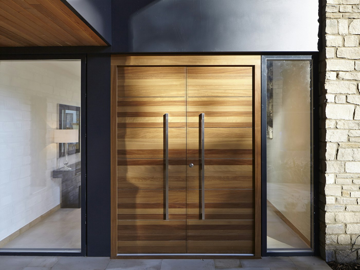 Front double doors in iroko wood with glass side panels (side lights)