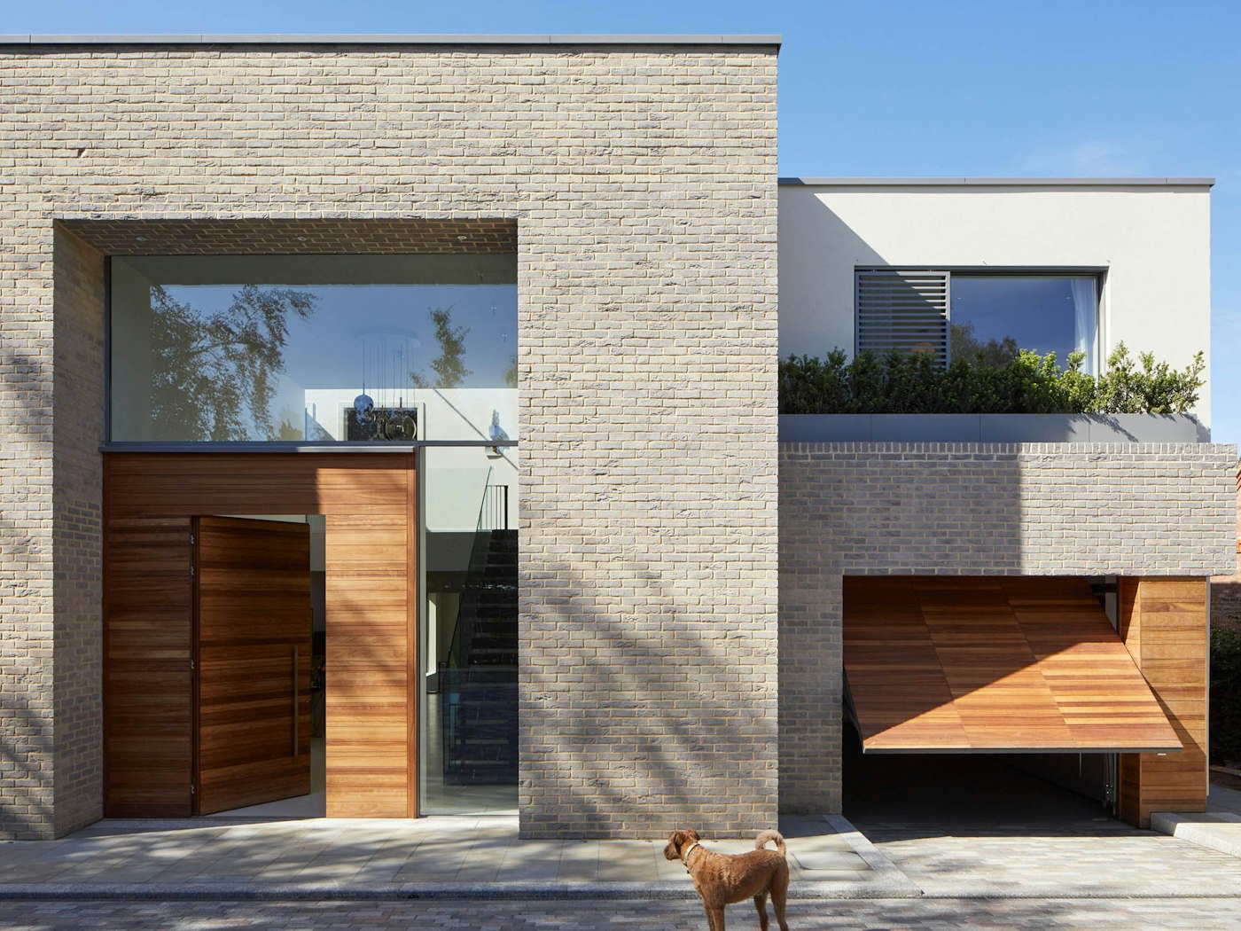 Contemporary new build with matching door and garage in iroko