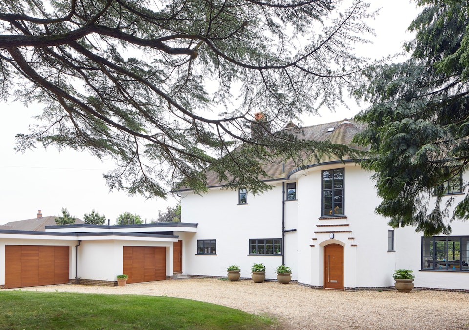 A 1930's house remodelled with matching front and garage doors