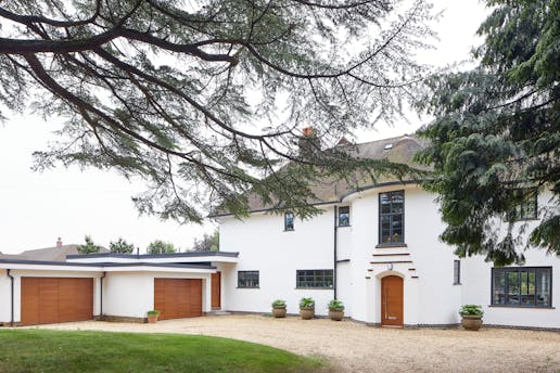 A 1930's house remodelled with matching front and garage doors