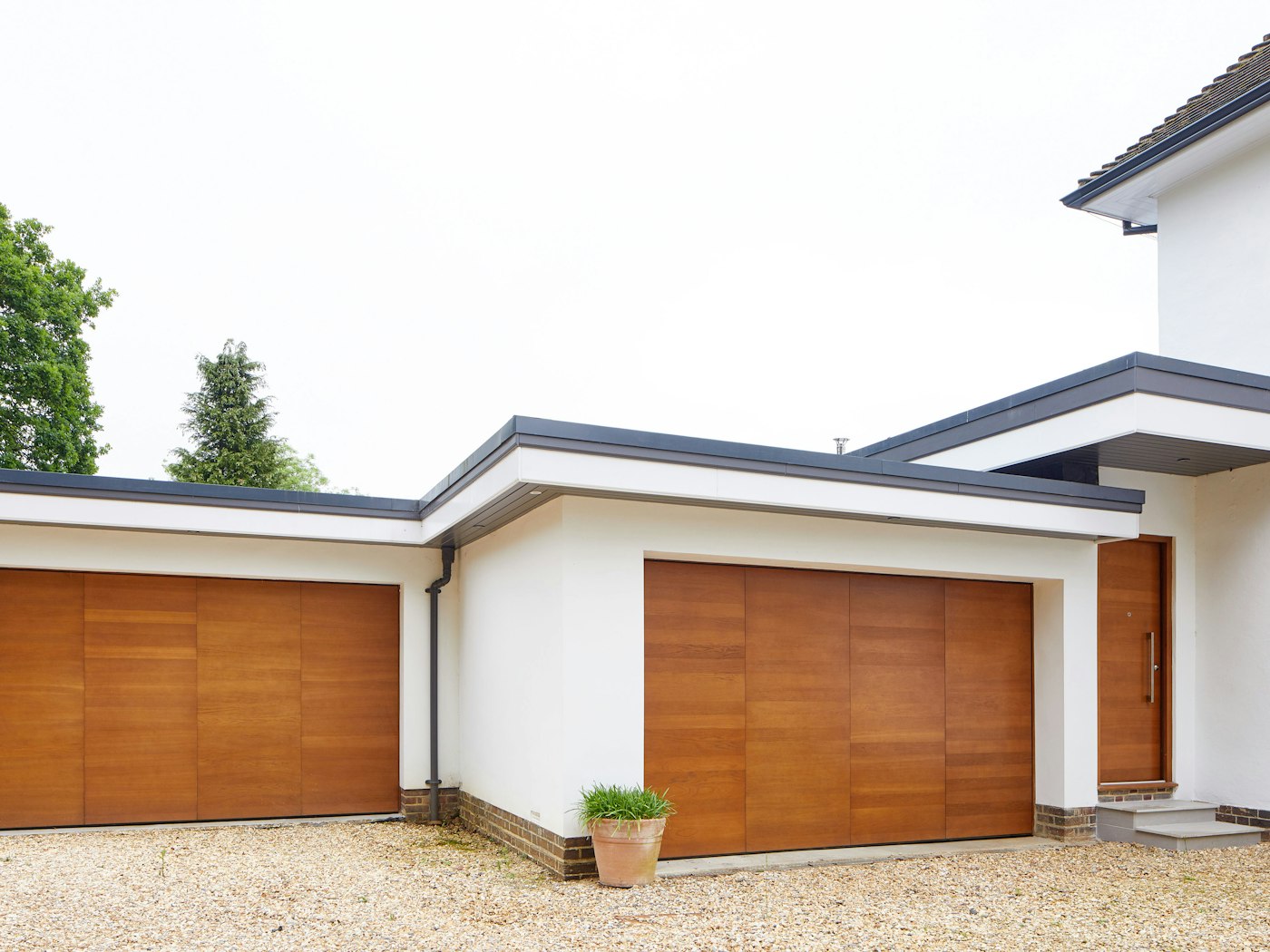 The matching up and over garage doors perfectly complement the traditional house style