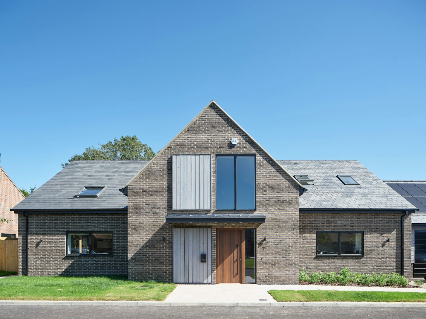 Rockwell house design 1 with Raw V fumed oak option11 black door Urban Front