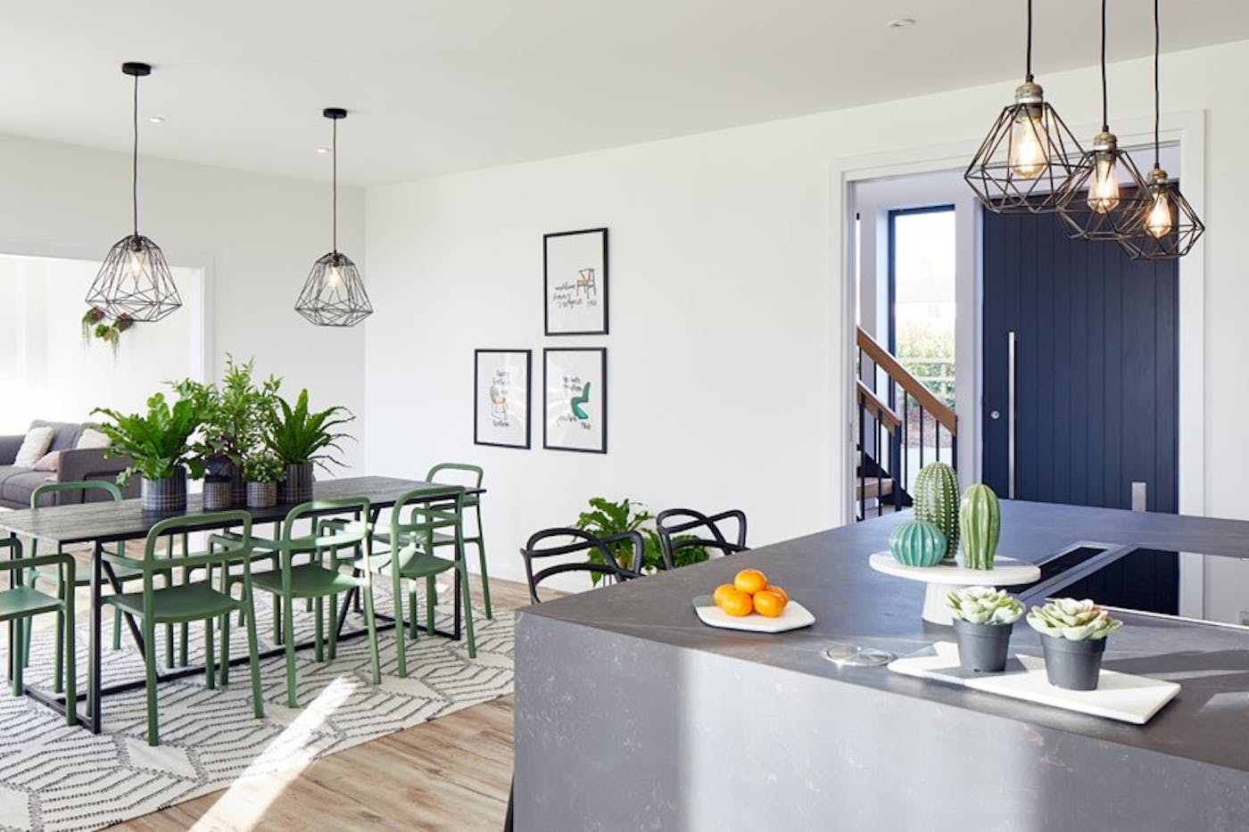 The contemporary feel is continued internally with accents of concrete & green