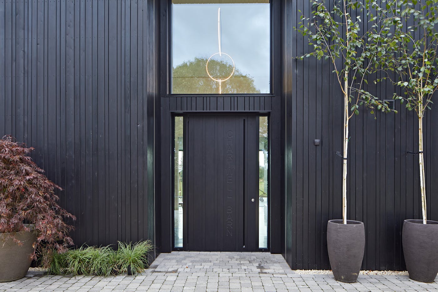 An Urban Front door in ebony oil with matching cladding